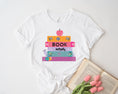 Load image into Gallery viewer, Bookworm with stack of books t-shirt | 5 colors | March is reading month