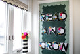 Load image into Gallery viewer, march is reading month door decor