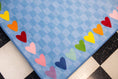 Load image into Gallery viewer, Blue Checkerboard Rug with Rainbow Hearts Border Classroom Rug by Schoolgirl Style