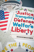 Load image into Gallery viewer, Educational materials celebrating Constitution Day with text and an American flag.