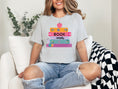 Load image into Gallery viewer, Bookworm with stack of books t-shirt | 5 colors | March is reading month