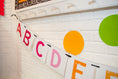 Load image into Gallery viewer, Large Alphabet Pennants Banner Happy Rainbow by UPRINT