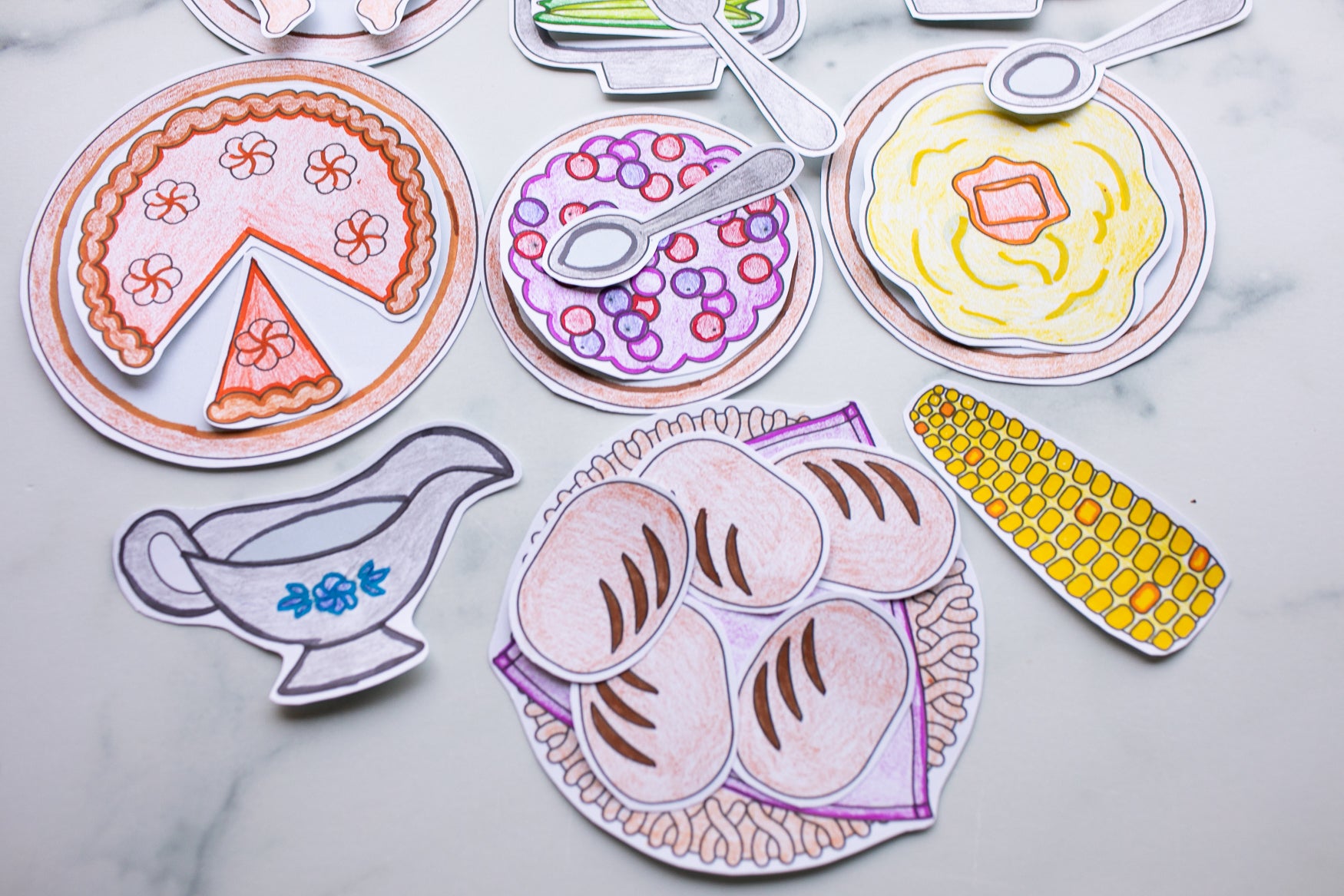 Colorful illustrations of food items on a marble surface