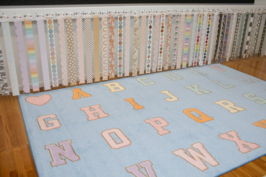 sky blue classroom rug with abc sit spots