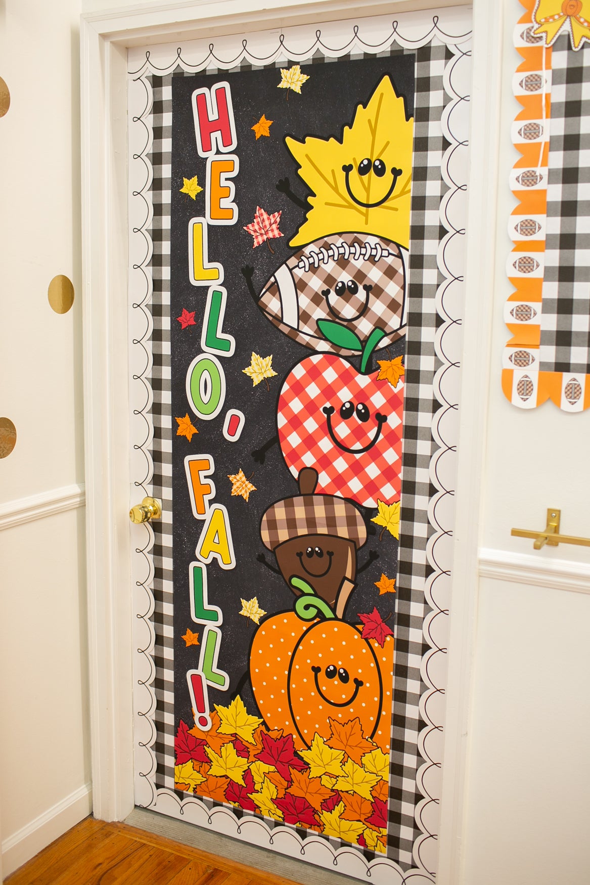 hello fall in primary colors walgreens classroom banner with a pumpkin, acorn, acorn, pumpkin, football and leaf on it with gingham details on a black background. 