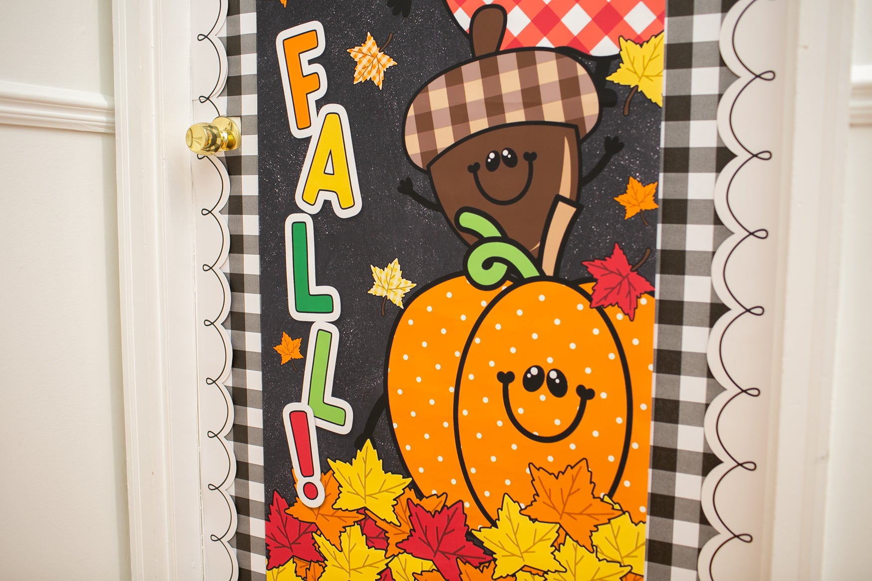 hello fall in primary colors walgreens classroom banner with a pumpkin, acorn, acorn, pumpkin, football and leaf on it with gingham details on a black background. 