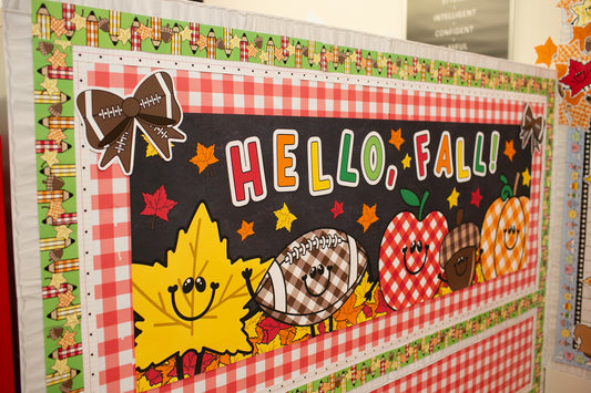 hello fall in primary colors walgreens classroom horizontal banner with a pumpkin, acorn, acorn, pumpkin, football and leaf on it with gingham details on a black background. 