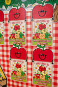 Load image into Gallery viewer, A close-up of a red and white checkered surface with repeated printed apple-themed labels that read 'OUR WORK IS APPLE-SOLITELY AWESOME!' and 'APPLE-SOLITELY AWESOME!'. The labels feature smiling red apples and fruit illustrations.
