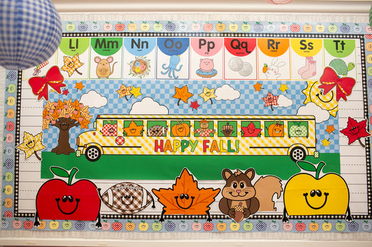 horizontal happy fall classroom banner that you get printed at Walgreens and the bus has happy fall icons peeking out of the window such as a leaf, scarecrow, acorn, and gingham apples.  