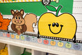 Load image into Gallery viewer, fall giant cutout toppers for the classroom.  Apples, football, leaf, and a squirrel.  
