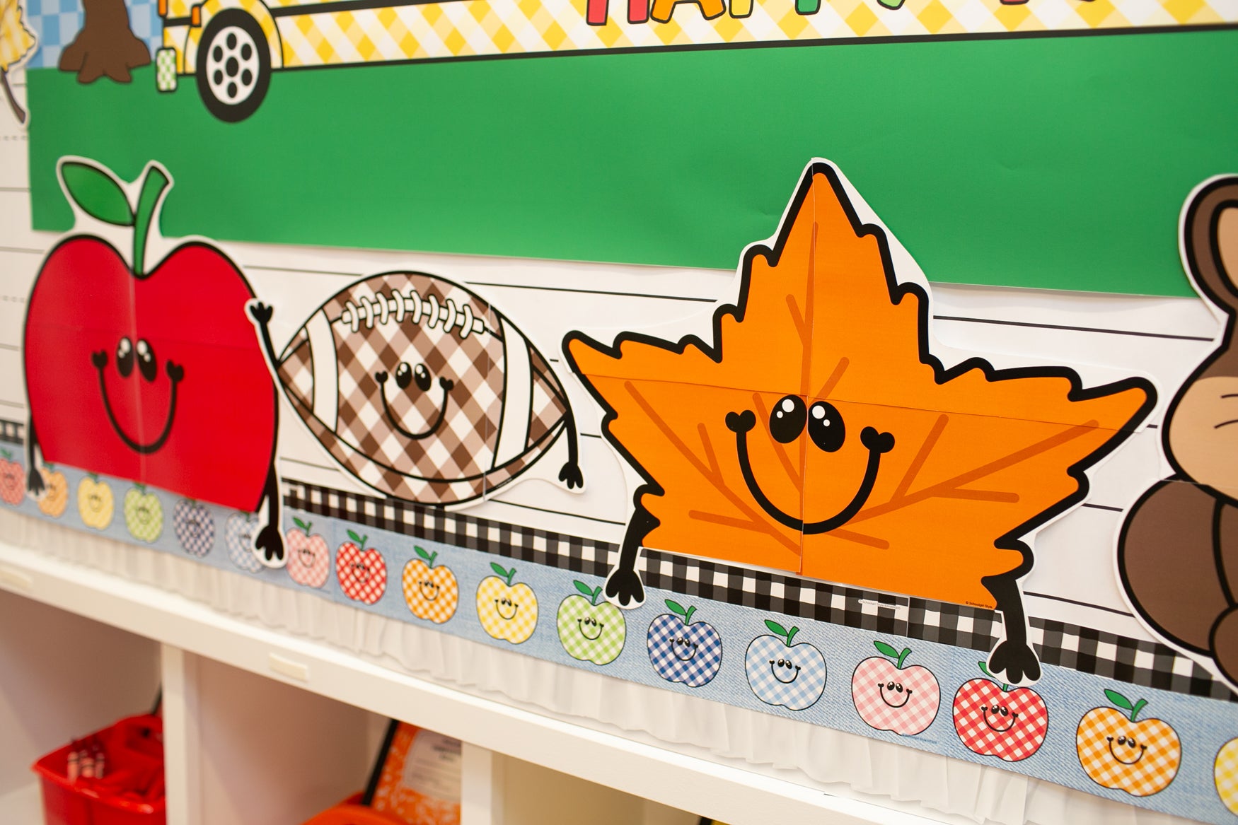 fall giant cutout toppers for the classroom.  Apples, football, leaf, and a squirrel.  