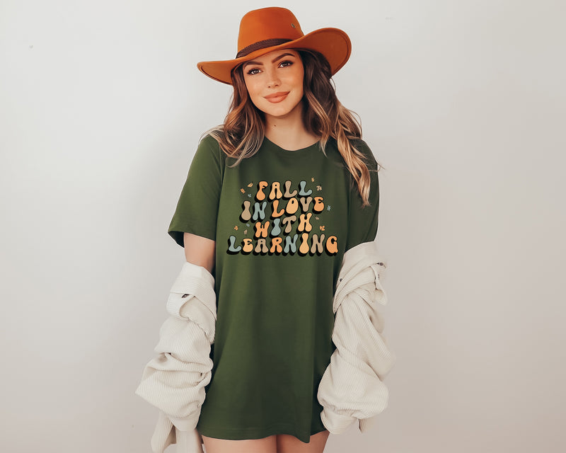 'Fall in Love with Learning' Teacher T-Shirt | In green, tan and white