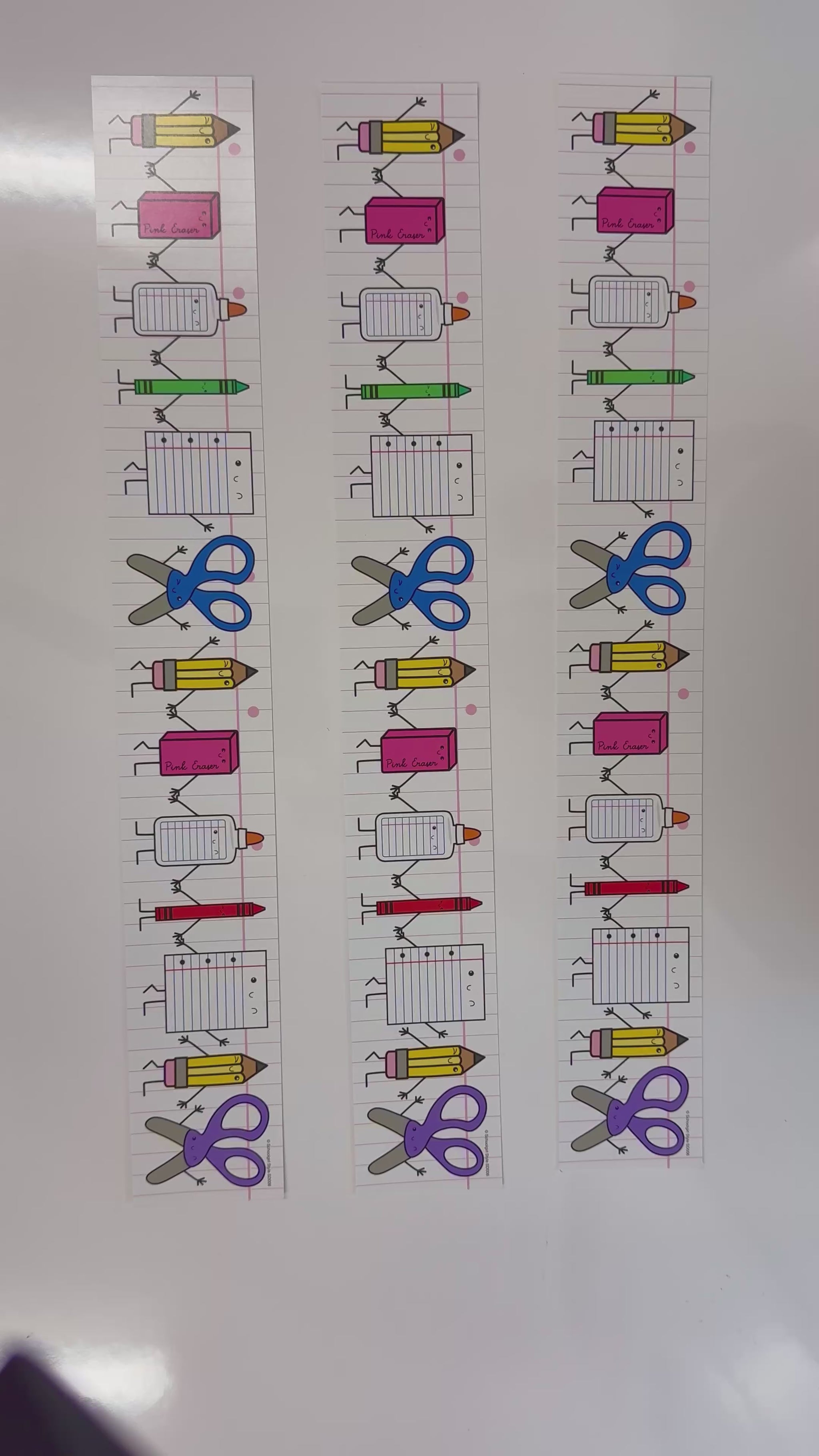 Colorful school supplies with notebook paper border