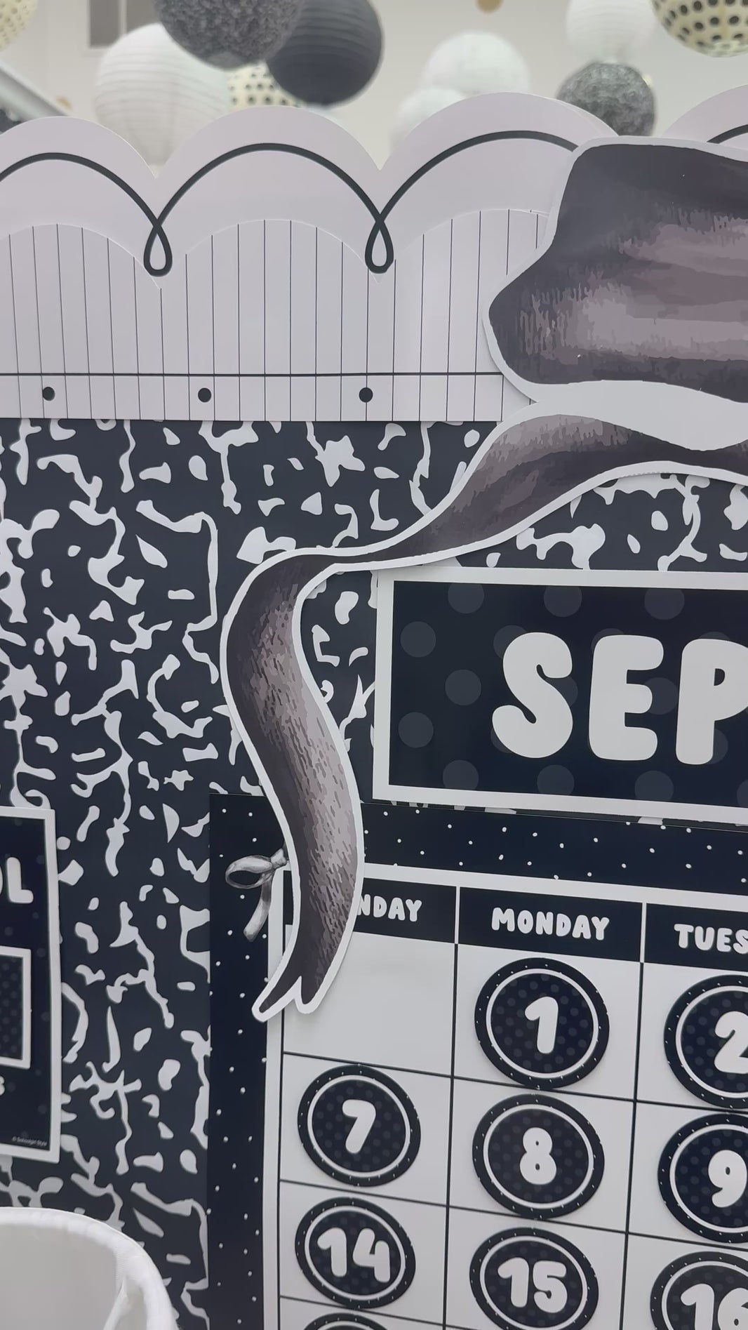 Large black bow calendar topper with black checkered puffy bows 