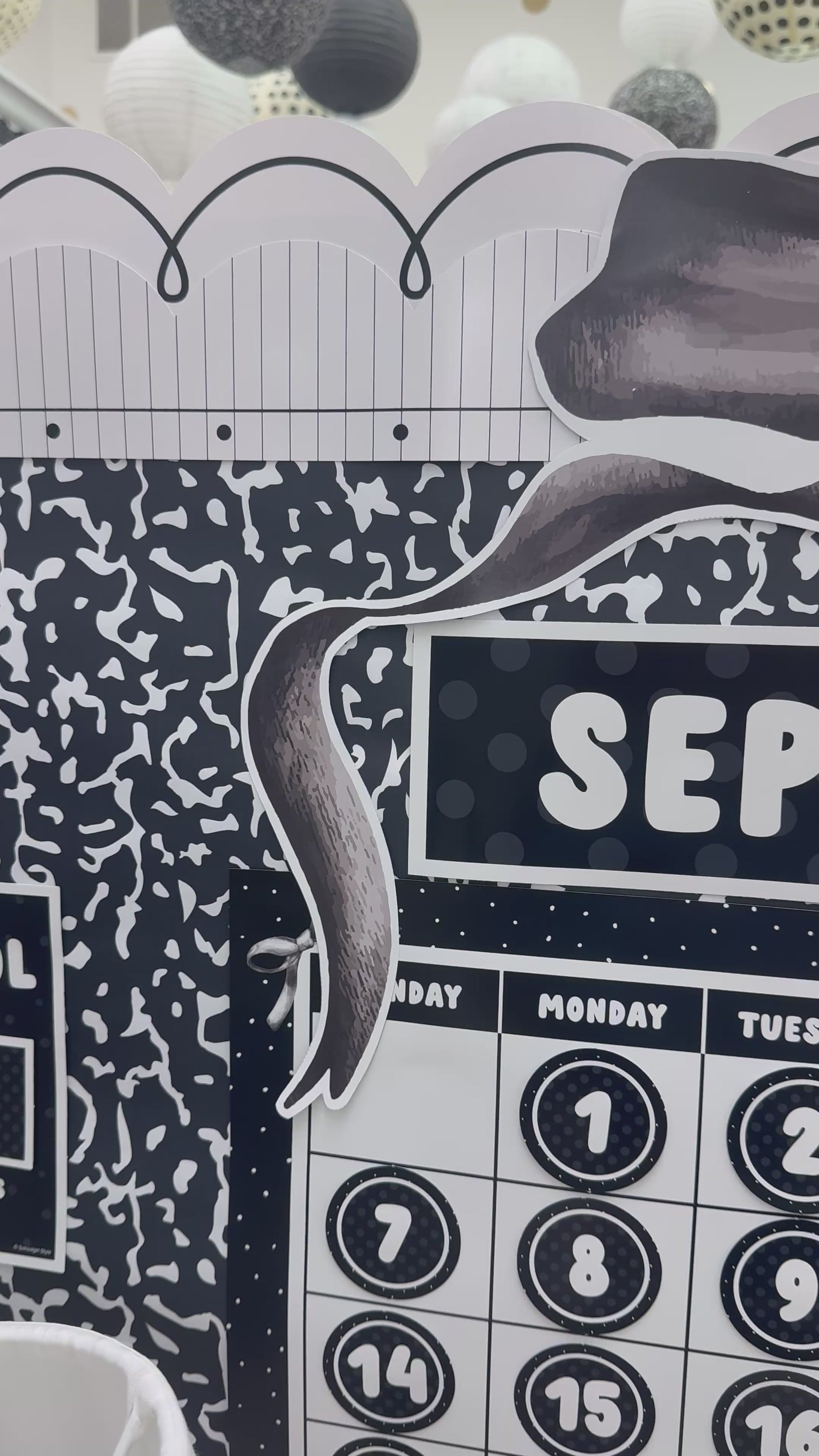 Large black bow calendar topper with black checkered puffy bows 