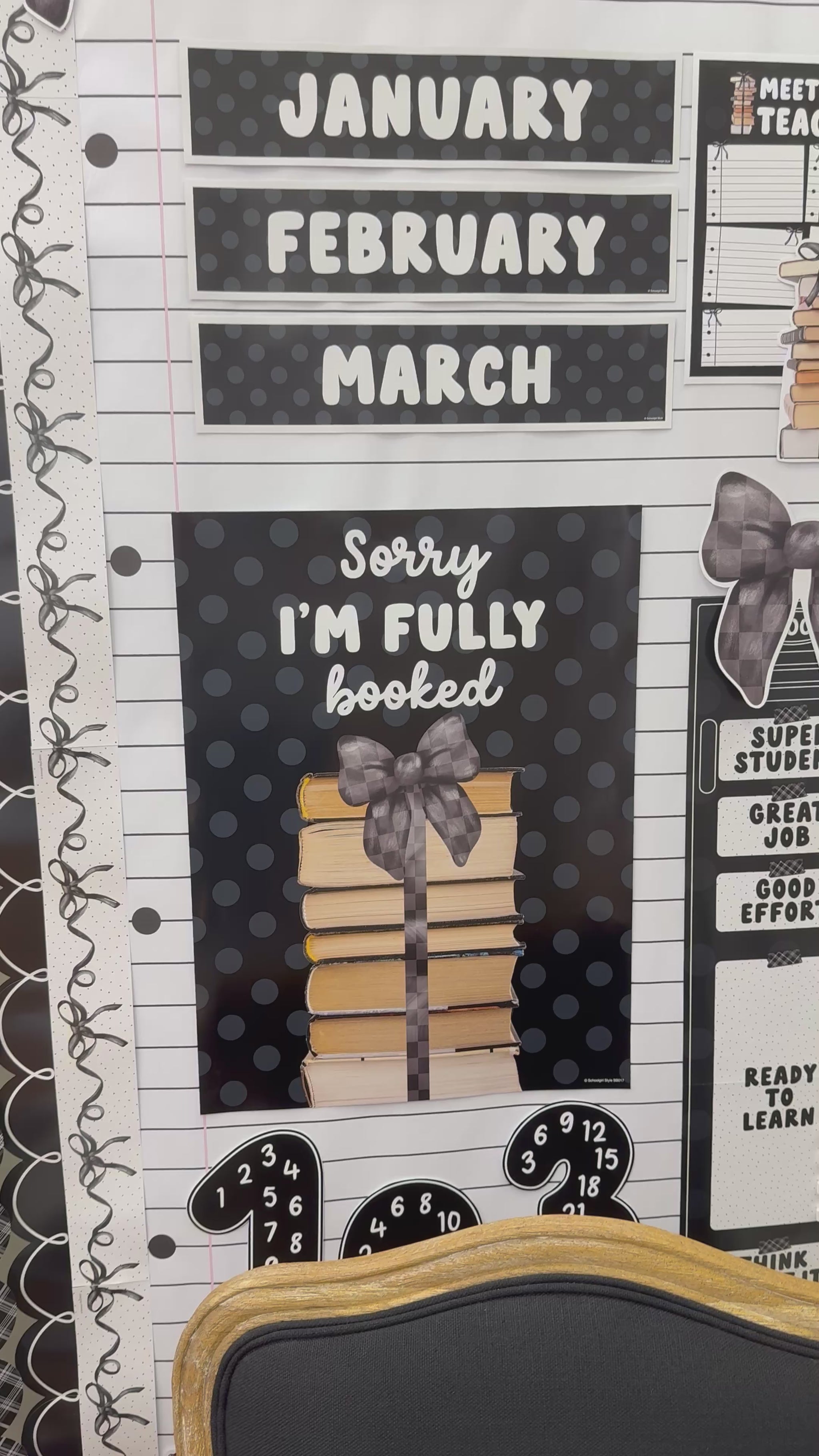 Sorry I’m fully booked black and white poster with book stack 