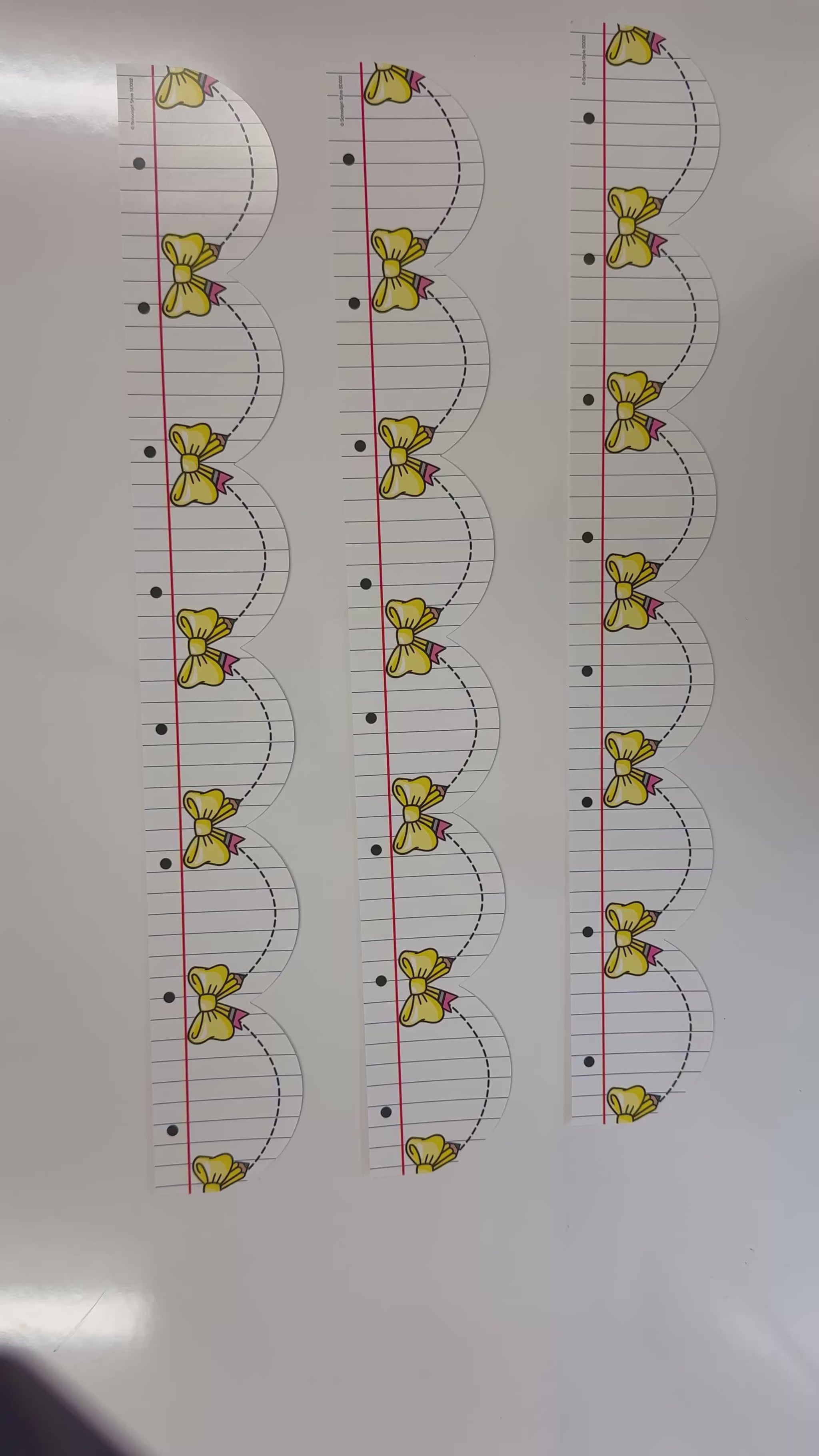 notebook paper with yellow bows border 