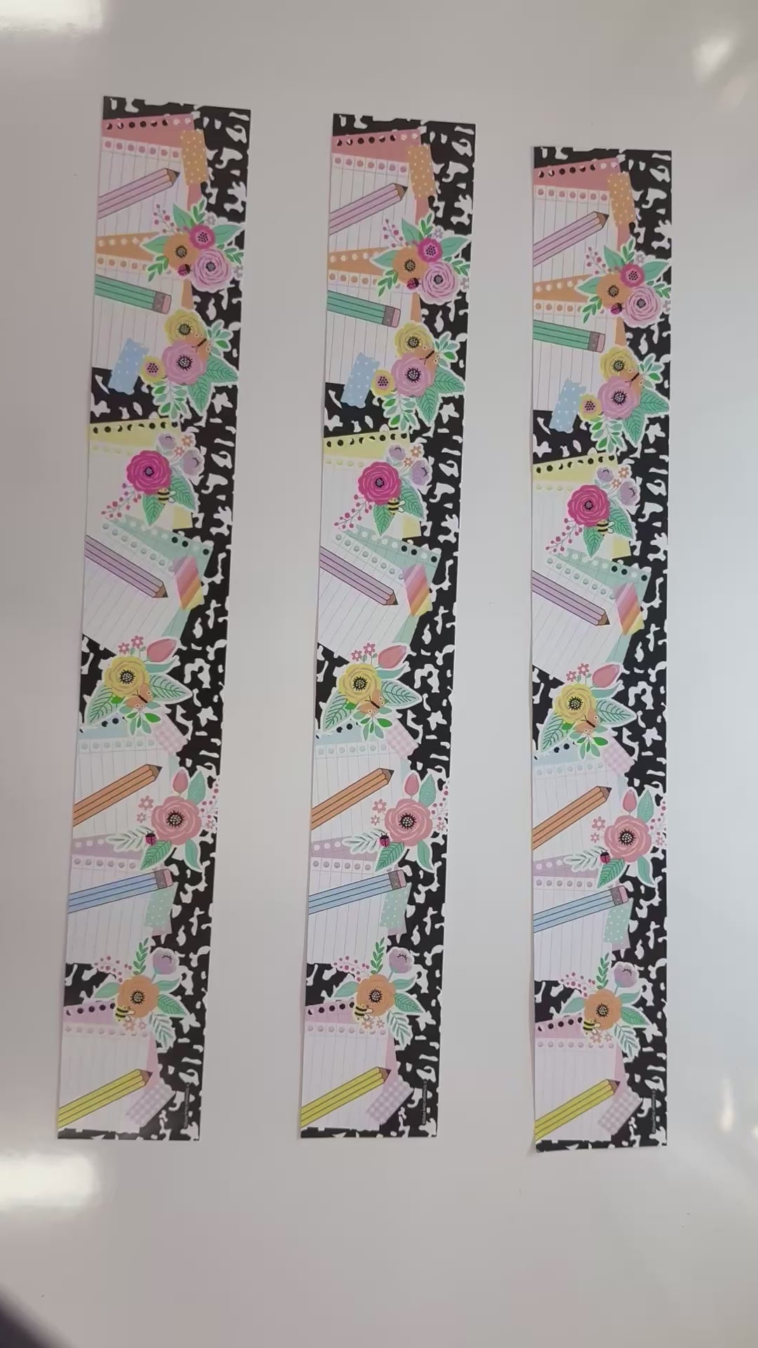 Pastel floral black and white composition notebook border with pencils 