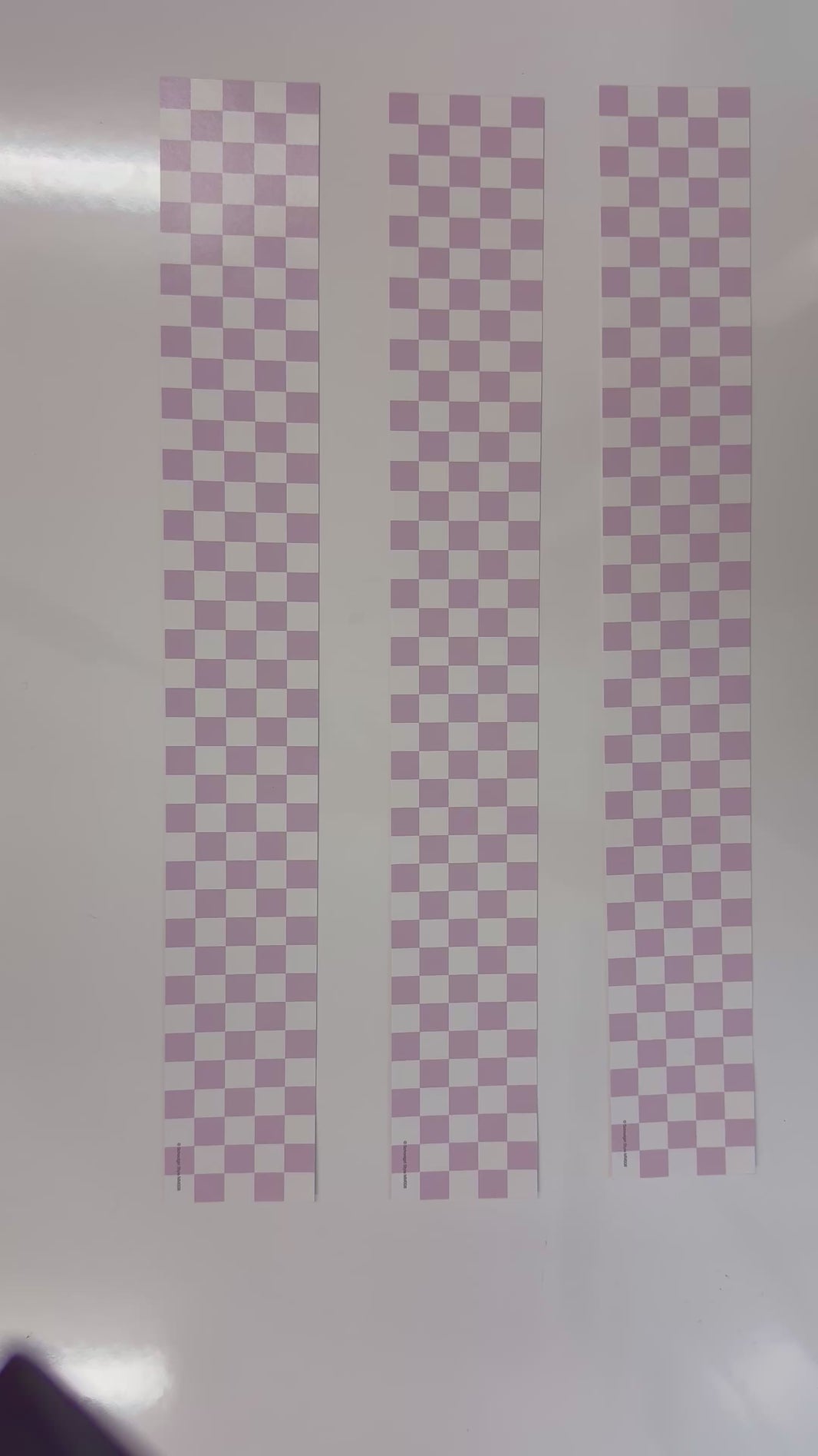 White and light purple checkered border 