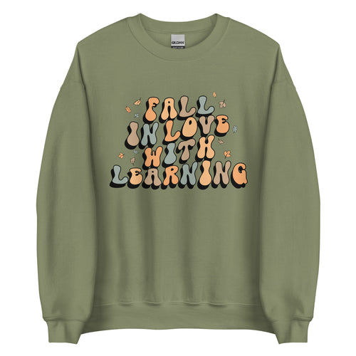 'Fall in Love with Learning' Teacher Crewneck Sweatshirt in green, pink, white and tan